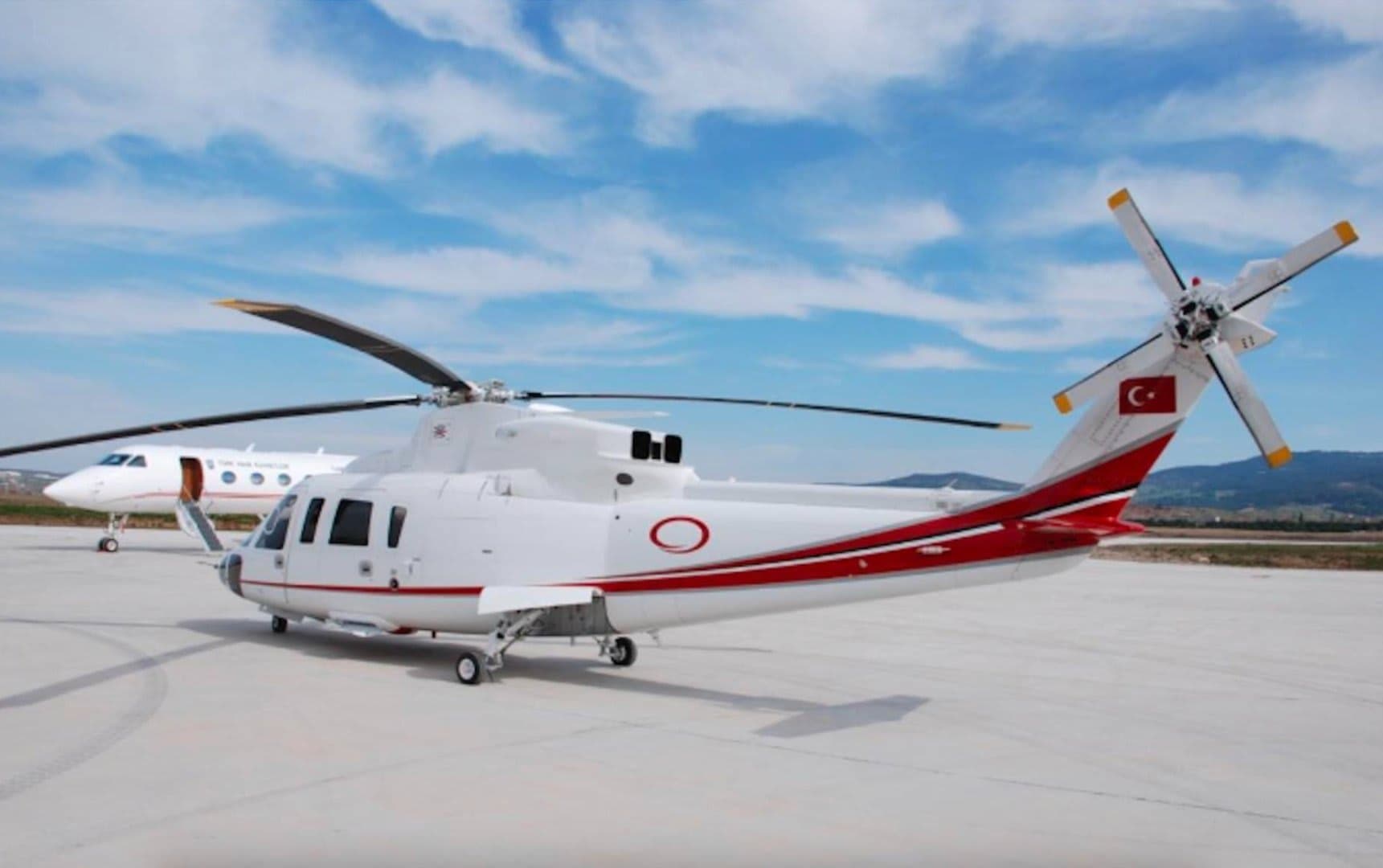 Helicopter landing on Alps helipad in European ski resort